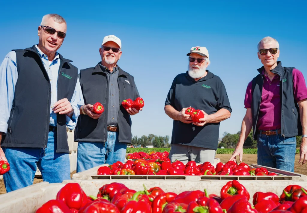 Eckert Cold Storage Team with Fresh Red Bell Peppers